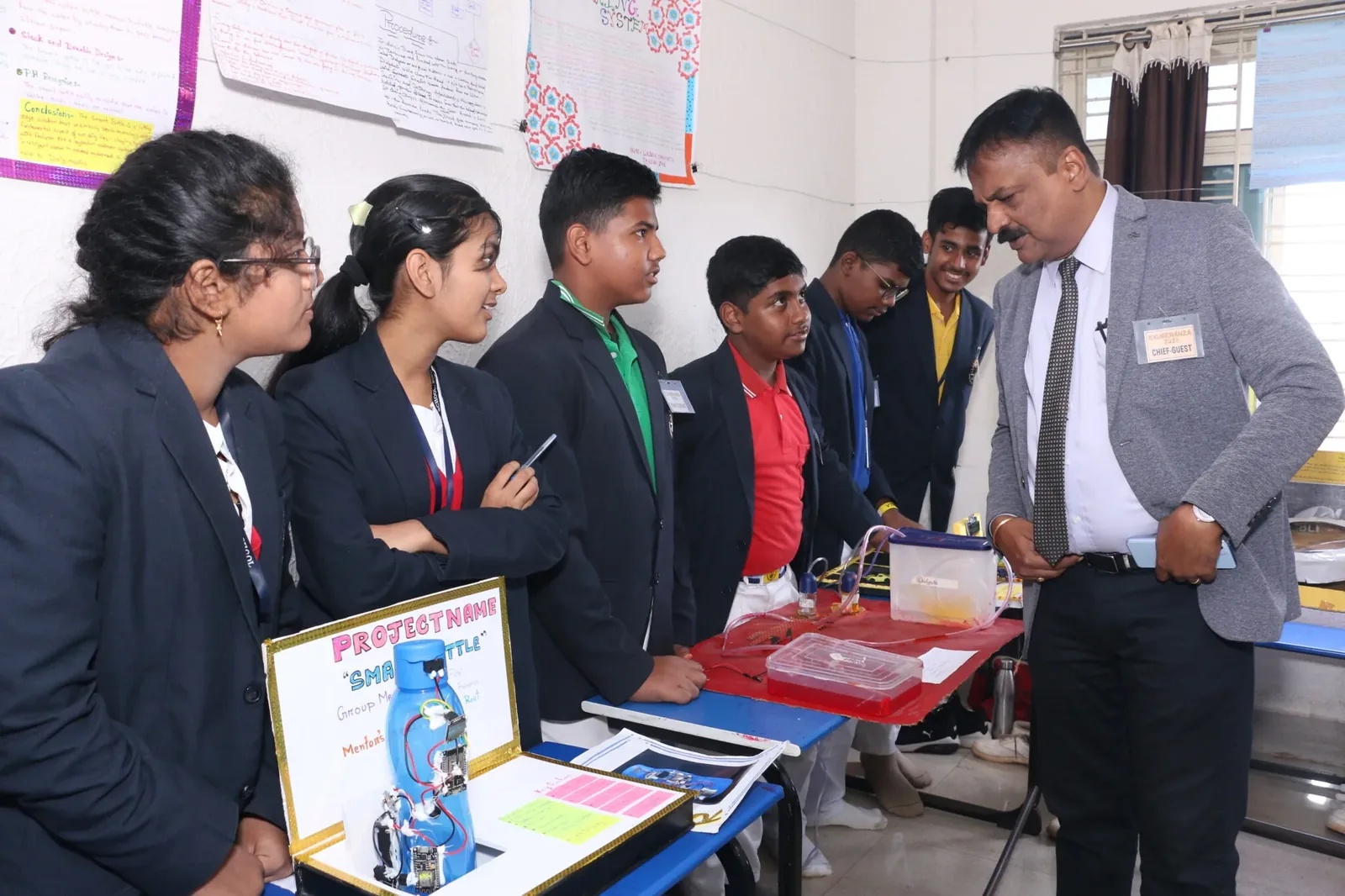 Students presenting a science project at the annual science exhibition.