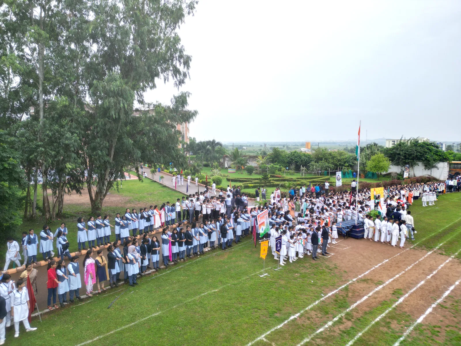 Aerial photograph of the green Jupiter Public School campus on NH-16.