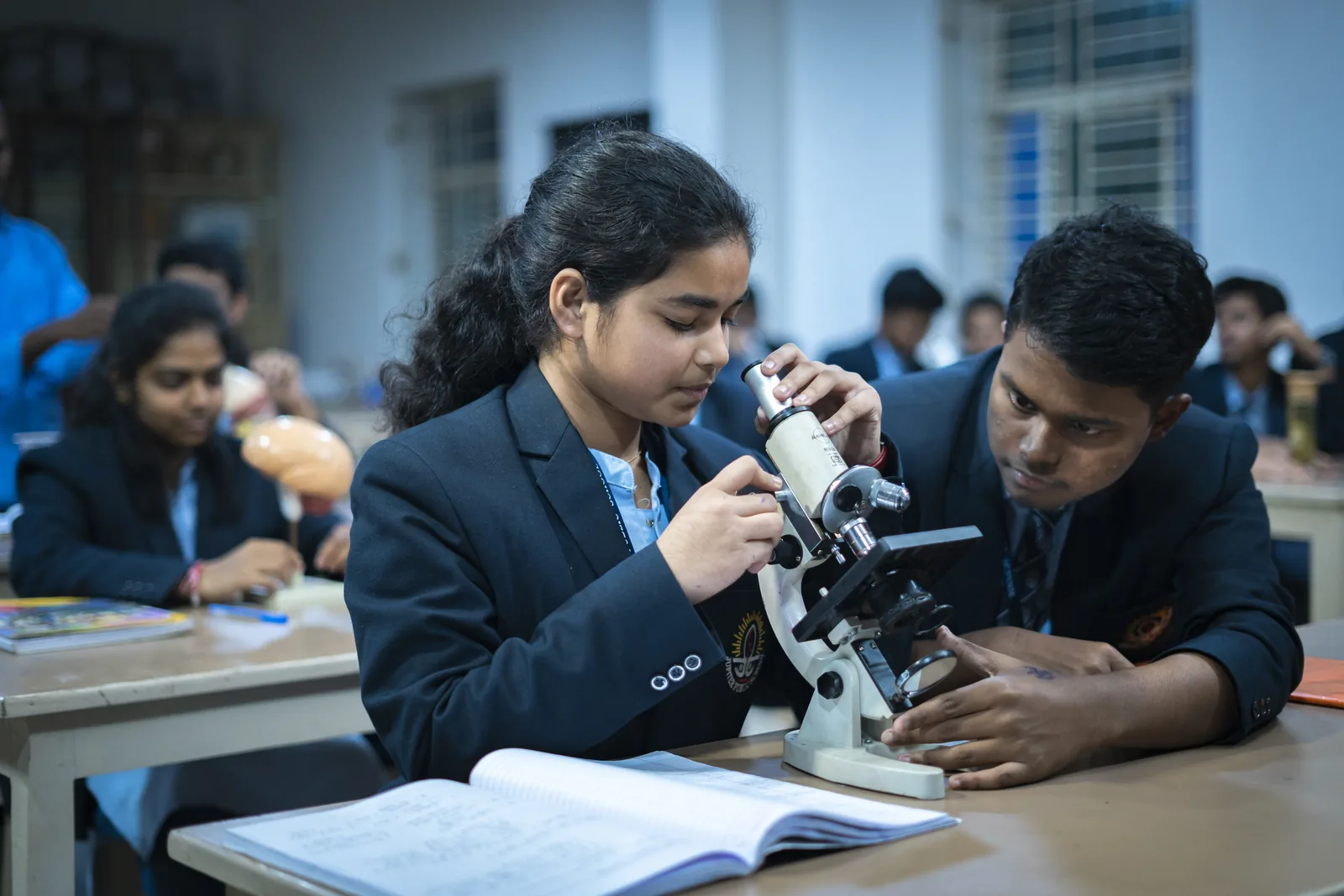 Two Jupiter students running an experiment in the chemistry lab