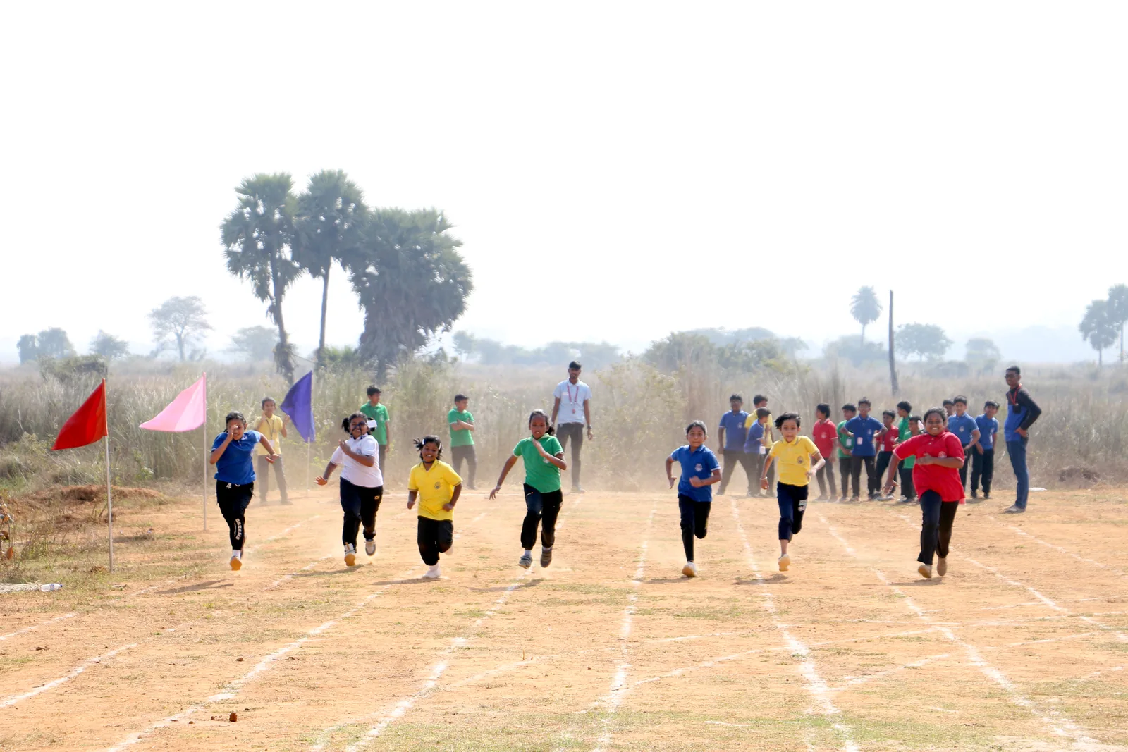Sports day running track, tournament tents and student athletic contingents.